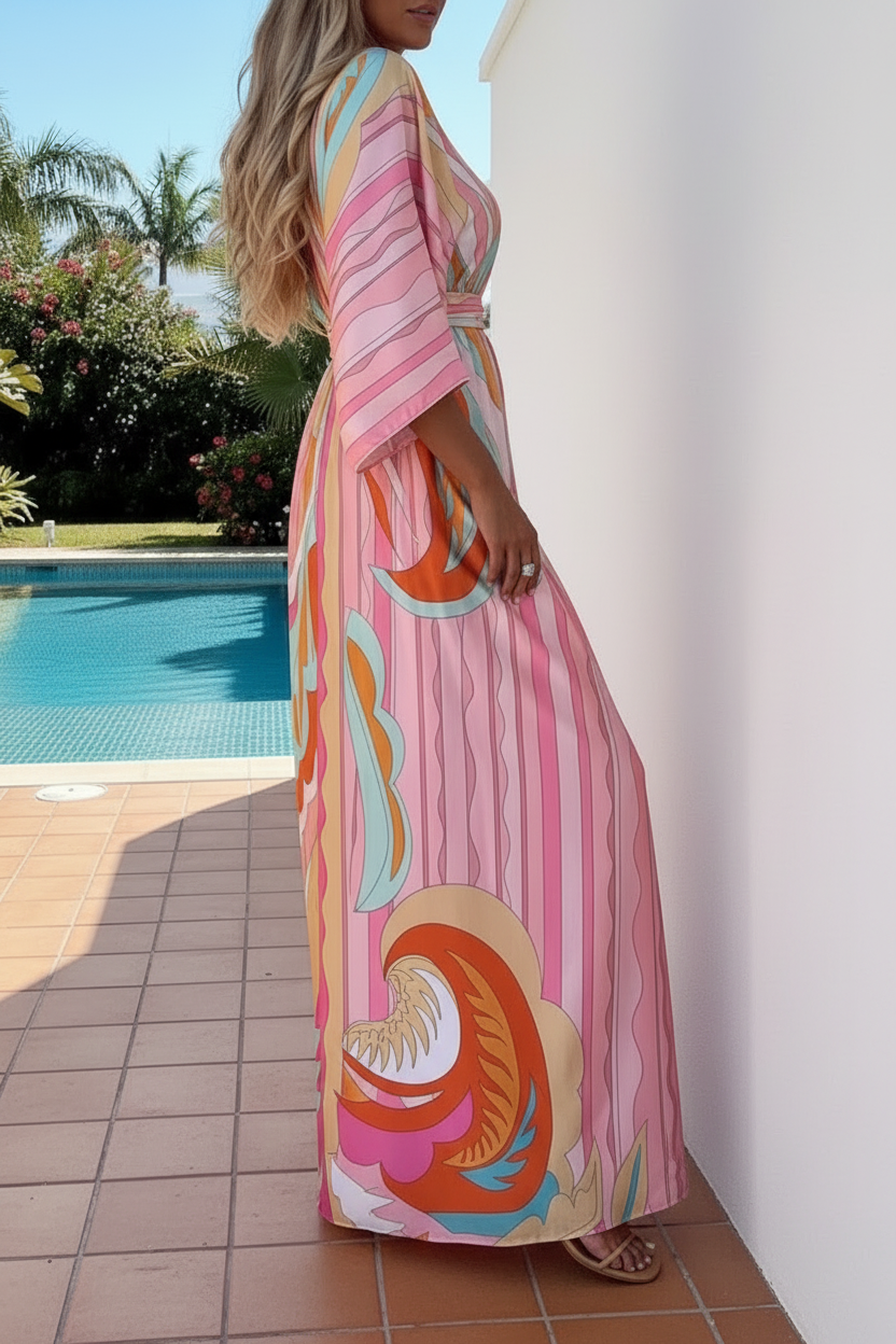 Girl wearing Enya pink Kaftan Dress from Villa Vibes and standing near pool