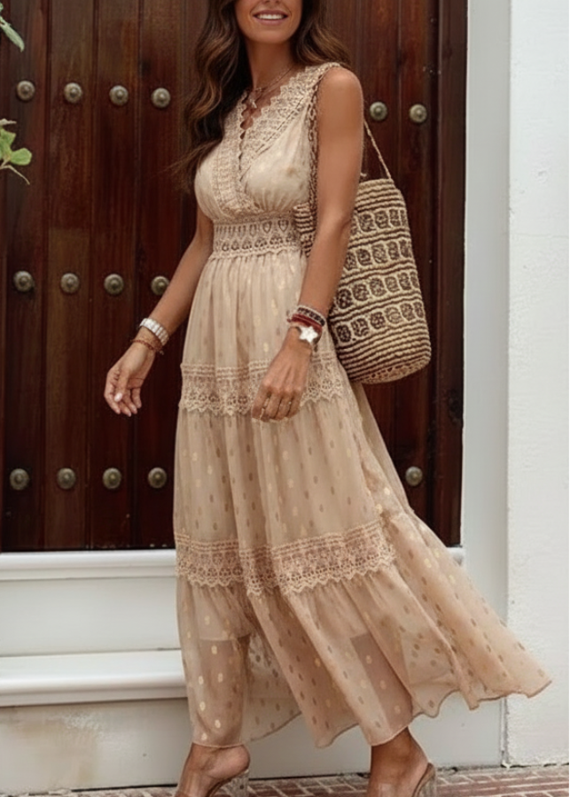 Woman wearing Indra Nude lace dress standing in front of a wooden door.
