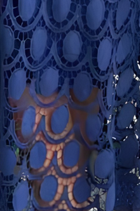 Close-up of Villa Vibes sapphire blue lace garment with intricate patterns.