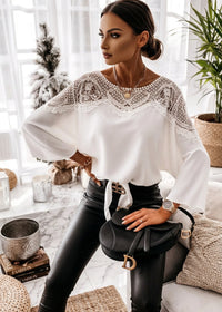  St Barts White Lace Top with lace details worn by a person, sitting indoors.