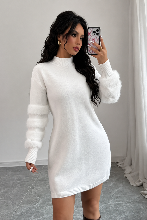 Woman taking a mirror selfie wearing a Villa Vibes Tanner white sweater dress.