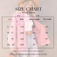 Size chart for Villa Vibes Brydie clothing with a model wearing a pink top and jeans, set against a neutral background.