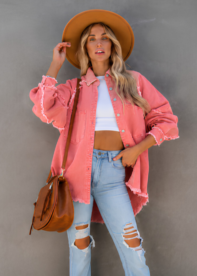 Model wearing Villa VIbes Brydie Pink Shirt wearing hat and carrying brown bag.