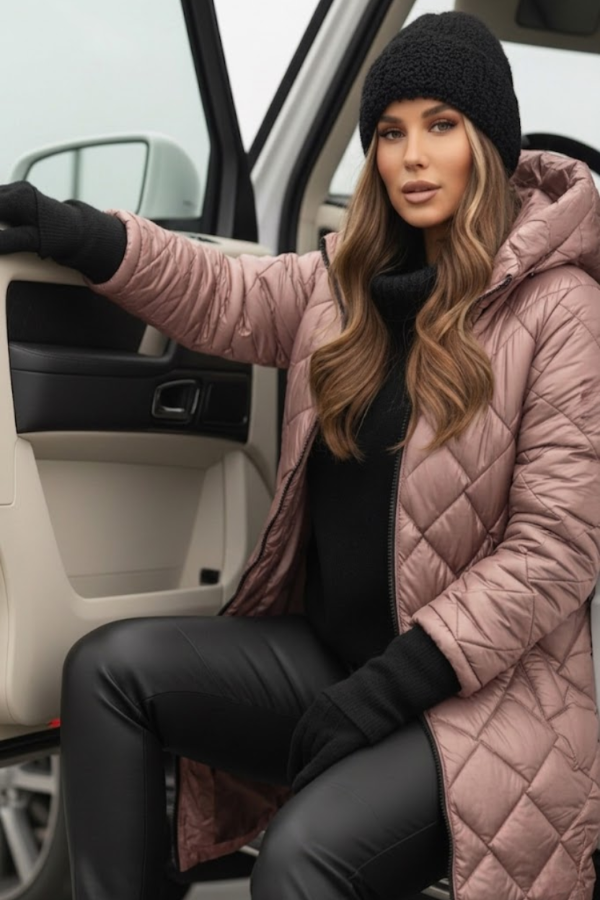 Woman in a Villa Vibes Cameron pink quilted coat and black beanie getting out of a car.