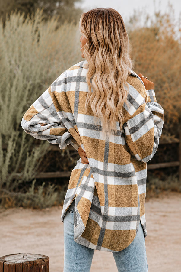 Woman wearing a Villa Vibes Cassidy plaid jacket in a natural setting