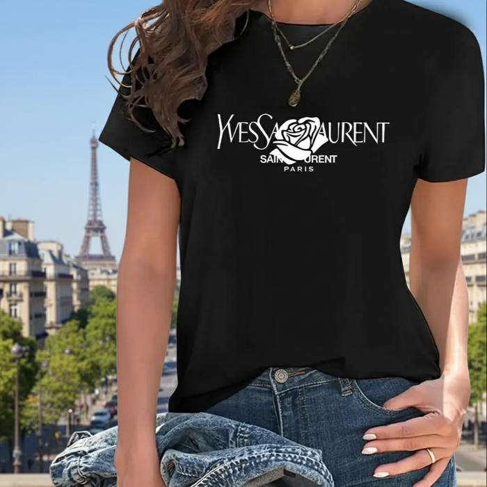 Person wearing a Villa Vibes black Yves Saint Laurent t-shirt with the Eiffel Tower in the background