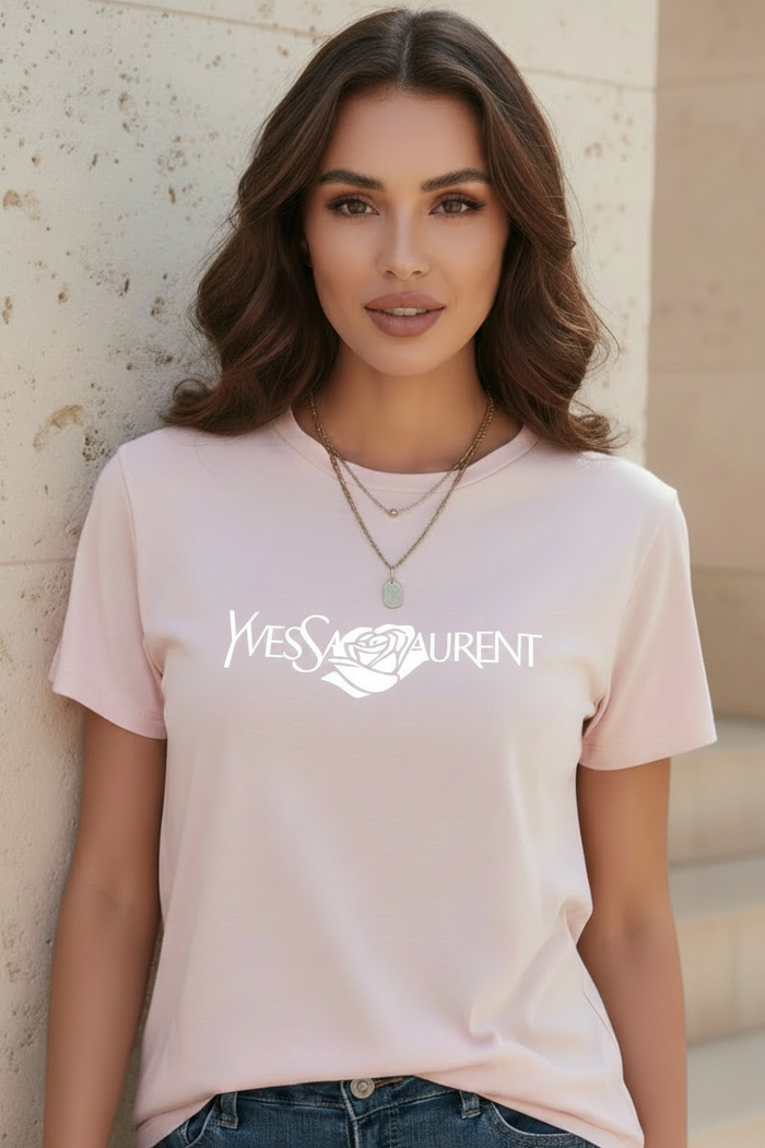 Woman wearing a Villa Vibes light pink designer inspired t-shirt with a brand logo 