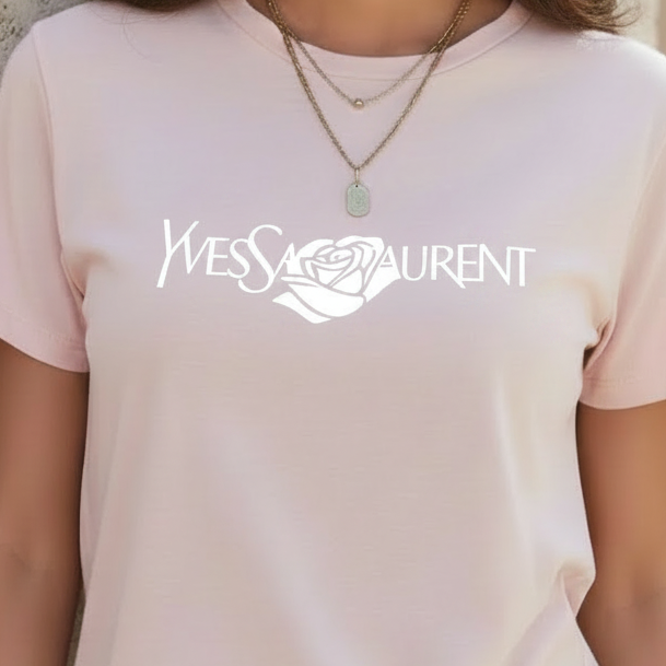 Person wearing a Villa Vibes light pink t-shirt with Yves Saint Laurent logo