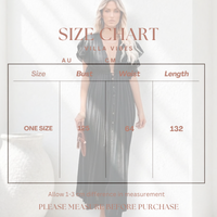 A size chart graphic for the 'Villa Vibes' Holly dress, showing a faded model wearing the dark pleated midi dress behind a measurement table with bust, waist, and length measurements in centimeters.