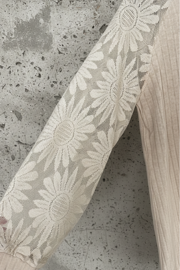 Villa Vibes Ariel Top Lace fabric with floral pattern on a textured surface