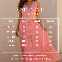 Villa Vibes Indra Coral Peach dress with size chart overlay on a plain background