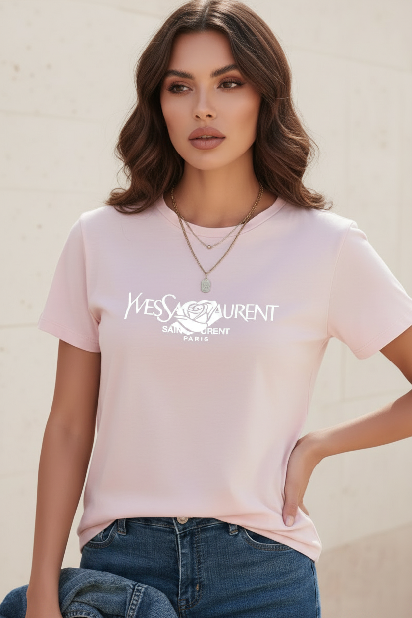 Woman wearing a Villa Vibes pale pink designer label t-shirt with a logo 