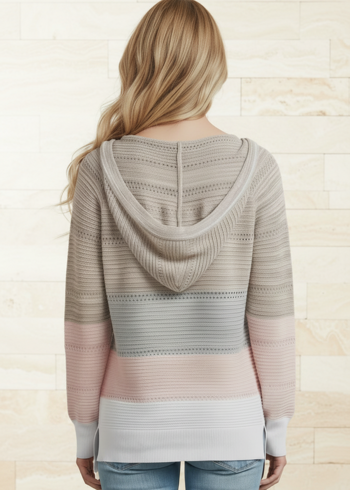 Woman wearing a Villa Vibes Pippa patterned hoodie with a neutral color scheme on a light background