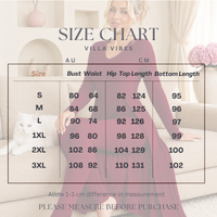 A size chart graphic for the 'Villa Vibes' brand, showing measurements in centimeters and centimeters for sizes S through 3XL. A woman in a mauve dress and a white cat are pictured in the background of a softly lit living room.