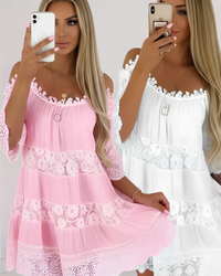 Two women wearing pink and white lace fallon dresses.